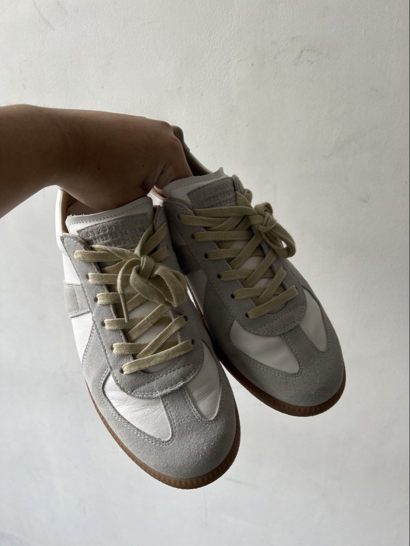 Maison Margiela GATS (Category: Sneakers) located in Malabon City. Submitted by Crypticindustries (Listing ID 1464169780, Image 2). Description: - Classic Maison Margiela Replica sneakers - White leather with grey suede accents - Retro gum sole - Light cream laces - Ideal for everyday wear - Wardrobe staple.