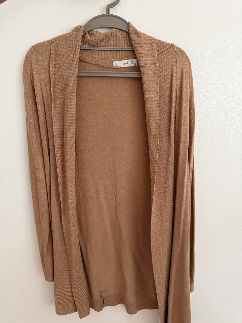 Mango Brown Knit Cardigan (Category: Coats, Jackets and Outerwear) located in Paranaque City. Submitted by ferrewr (Listing ID 1464210552, Image 1). Description: - Mango brown knit cardigan - Long sleeves - Open front style - Soft and lightweight knit - Ideal for layering over tops or dresses - Versatile for casual outings or relaxed office looks.