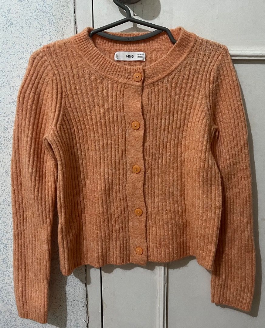 MANGO Orange Button-Up Cardigan (Category: Longsleeves) located in Cavite. Submitted by classicsale (Listing ID 1464170024, Image 1). Description: Mango Cardigan Top Good Condition Brand: Mango Color: Orange Size: XXS Selling for: Php 290 + Shipping Fee Payment: Gcash / Maya DM for more details .
