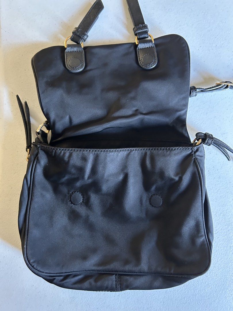 Marc Jacobs Black Nylon Crossbody Bag (Category: Cross-body Bags) located in Roxas City. Submitted by preloved_by_workingstudent (Listing ID 1464206324, Image 3). Description: HEARING OFFERS! Issue: Hardware - Gold Tone (signs of tarnish due to wash) bought in-store NOT UKAY Authentic Black Marc Jacobs Crossbody Bag Black Top Magnetic Button Closure Exterior: Nylon, Leather Trim. Interior: Nylon 11" L x 3.5" D x 7.5" H Long Handle Drop Length: 20