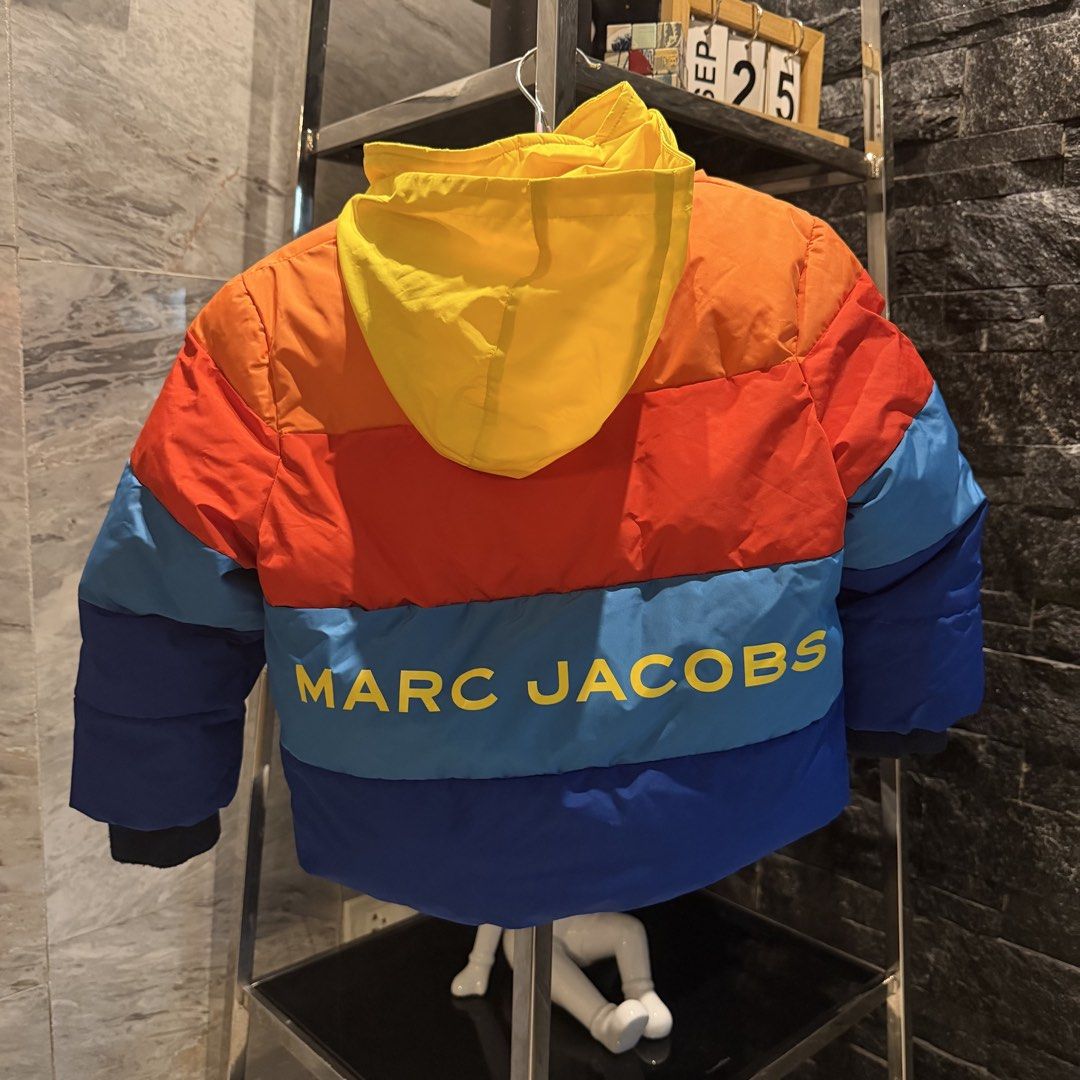 Marc Jacobs Kids Rainbow Puffer Jacket (Category: Babies & Kids Fashion) located in Manila. Submitted by iceonmyneck (Listing ID 1464200009, Image 2). Description: - Authentic Marc Jacobs puffer jacket for kids -Bought in Switzerland - Vibrant rainbow colors with a cheerful yellow hood - Iconic Marc Jacobs logo prominently displayed on the back - Features two convenient front pockets with secure button closures - with hood compartment - Size: S (