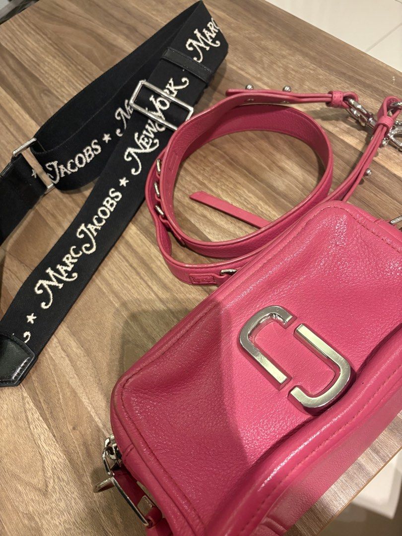 Marc Jacobs Pink Leather Snapshot Camera Bag with Strap (Category: Luxury Bags & Wallets) located in Manila. Submitted by prelovedhereee (Listing ID 1464290373, Image 2). Description: - Pink leather Marc Jacobs Snapshot camera bag - Detachable black crossbody strap with 'Marc Jacobs New York' lettering - Two zippered compartments for organization - Silver hardware details - Ideal for everyday use With extra guitar strap bought at 5K.