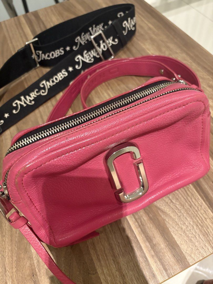 Marc Jacobs Pink Leather Snapshot Camera Bag with Strap (Category: Luxury Bags & Wallets) located in Manila. Submitted by prelovedhereee (Listing ID 1464290373, Image 1). Description: - Pink leather Marc Jacobs Snapshot camera bag - Detachable black crossbody strap with 'Marc Jacobs New York' lettering - Two zippered compartments for organization - Silver hardware details - Ideal for everyday use With extra guitar strap bought at 5K.