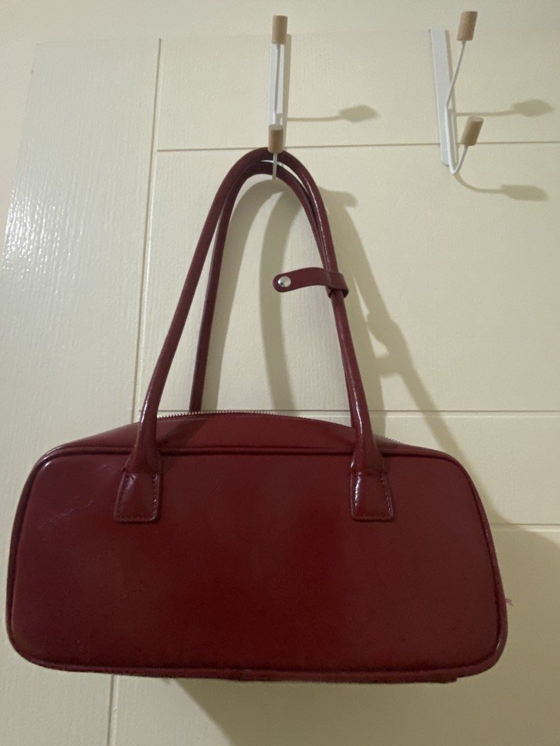 Maroon Patent Leather Shoulder Bag (Category: Shoulder Bags) located in Quezon City. Submitted by jiujitsu_la (Listing ID 1464149522, Image 1). Description: - Classic maroon shoulder bag - Shiny patent leather finish - Zipper closure across the top - Two comfortable shoulder straps - Ideal for everyday use or a night out - Easily fits your essentials - A versatile accessory for any outfit.