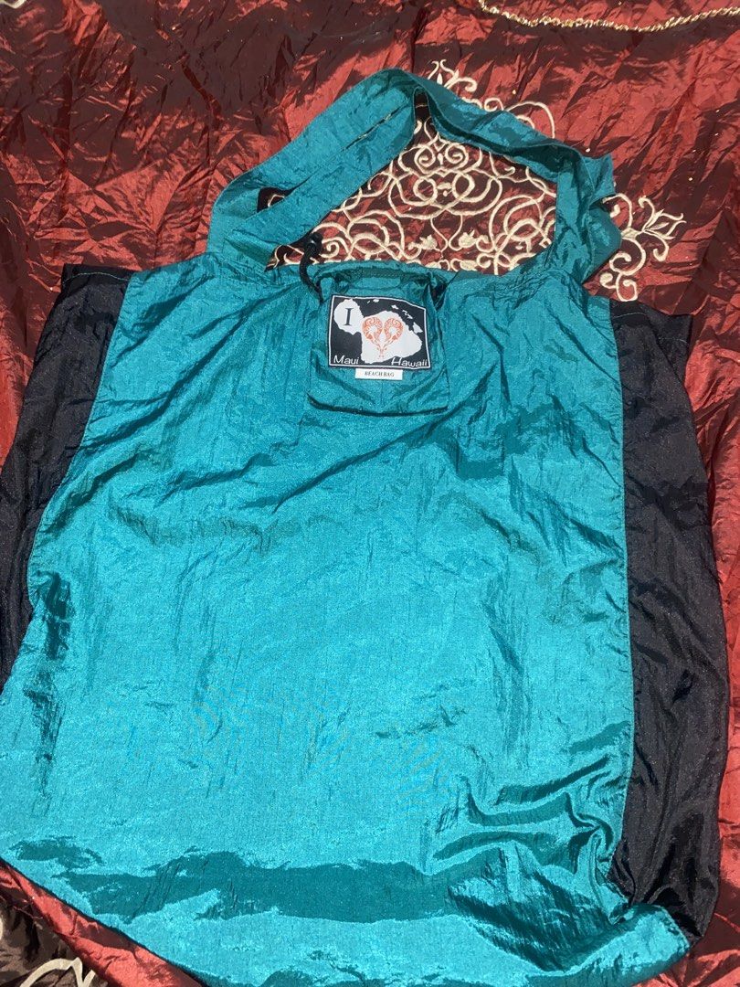 Maui Hawaii Tote Bag (Category: Tote Bags) located in Manila. Submitted by reginemarquez412 (Listing ID 1464232043, Image 2). Description: - Stylish teal and black tote bag - Ideal for grocery shopping or everyday use - Folds up small for easy storage - Features a cute patch on the front - Made from lightweight material.