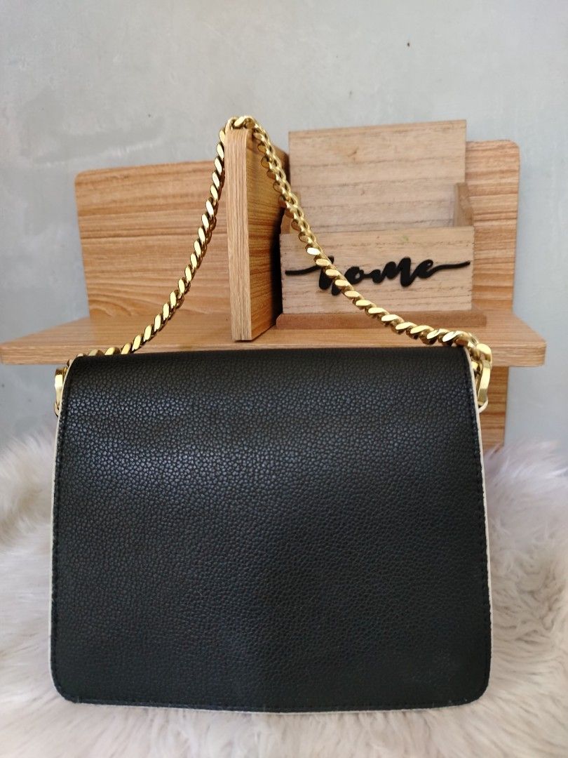MCM Mini Patricia Color block (Category: Luxury Bags & Wallets) located in Lucena. Submitted by gracious_chin0436 (Listing ID 1464141928, Image 2). Description: - Iconic MCM shoulder bag - Classic monogram print on front flap - Stylish black and white color blocking - Elegant gold chain strap - Secure lock closure - Versatile for day or night use - Handbag only missing long strap for crossbody - Normal to minimal sign of used on metal hardwares s