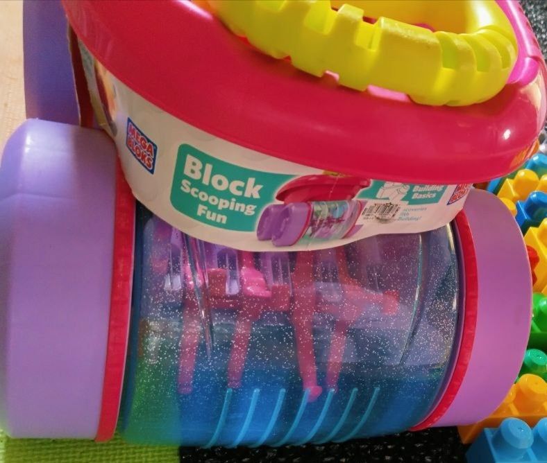 Mega Bloks Wagon Push Scooping Fun Building Blocks Cart (Category: Kids Toys) located in Pasig City. Submitted by babylove2003 (Listing ID 1464151195, Image 2). Description: Mega Bloks push cart for scooping fun. Comes with building basics. The cart has a steering wheel and a place to store blocks. The clear barrel has glitter inside. Great for little ones learning to build and push. Encourages active play..