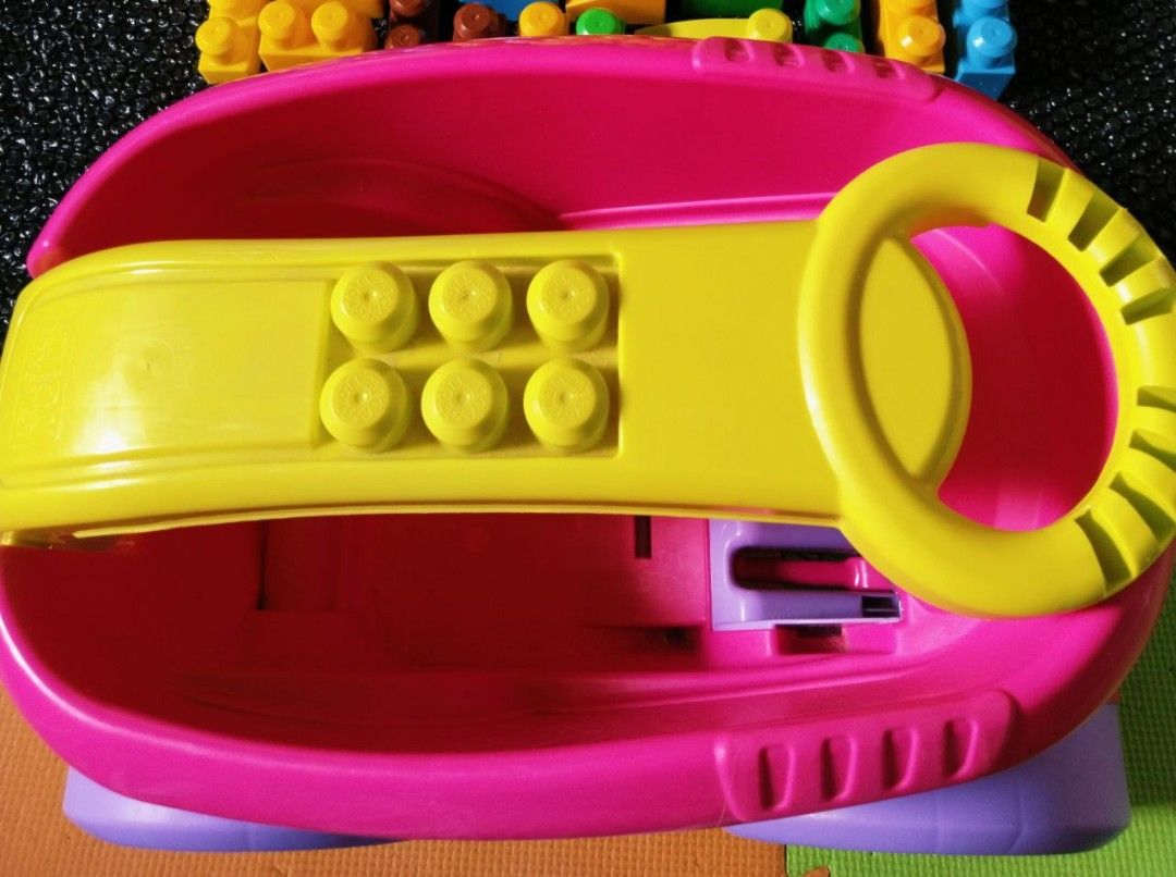Mega Bloks Wagon Push Scooping Fun Building Blocks Cart (Category: Kids Toys) located in Pasig City. Submitted by babylove2003 (Listing ID 1464151195, Image 3). Description: Mega Bloks push cart for scooping fun. Comes with building basics. The cart has a steering wheel and a place to store blocks. The clear barrel has glitter inside. Great for little ones learning to build and push. Encourages active play..