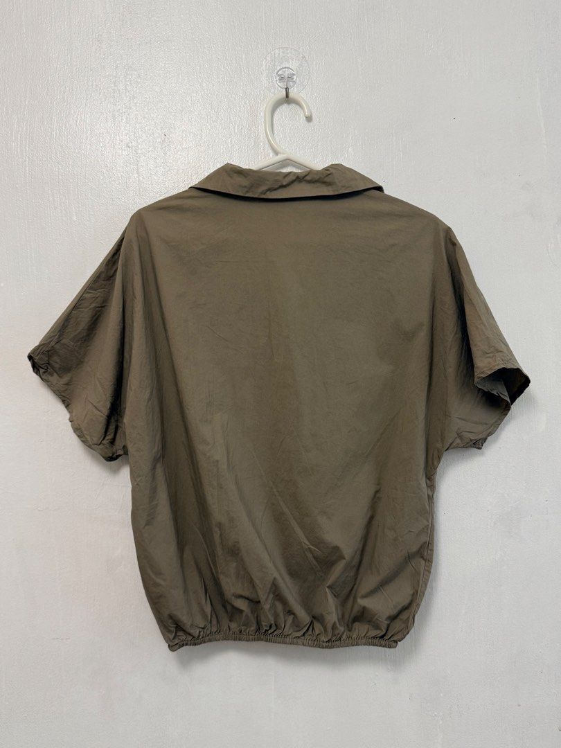 MEMO Olive Green Collared Short Sleeve Top (Category: Shirts) located in Mandaluyong City. Submitted by nftp24 (Listing ID 1464167967, Image 3). Description: - Olive green top from MEMO - Short sleeves - Collared neckline - Elasticated hem - Minor marks on the front (please check photos) .