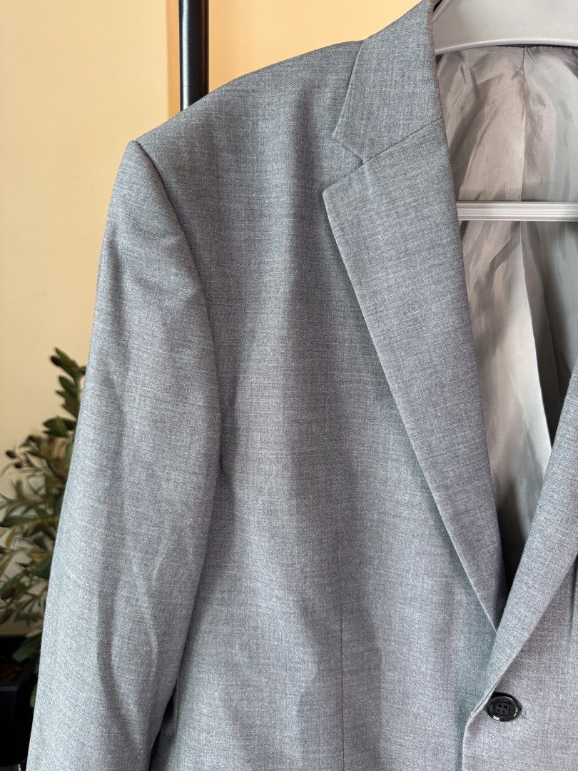 Men’s Slimfit Blazer (Category: Coats, Jackets and Outerwear) located in Mandaluyong City. Submitted by cartmyitems (Listing ID 1464215250, Image 2). Description: - Classic grey blazer - Two-button front closure - Two front flap pockets and one chest pocket - Fully lined interior - Ideal for formal or smart-casual occasions - A versatile addition to any wardrobe.