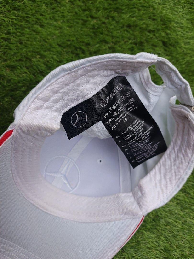 Mercedes Benz Cap White (Category: Caps & Hats) located in Dipolog. Submitted by vinzz_thrift (Listing ID 1464158401, Image 3). Description: - Classic white Mercedes-Benz cap - Iconic embroidered Mercedes logo on the front - Adjustable strap at the back with a stylish red stripe detail - Comfortable polyester and cotton blend fabric - Ideal for everyday wear or showing your love for the brand.