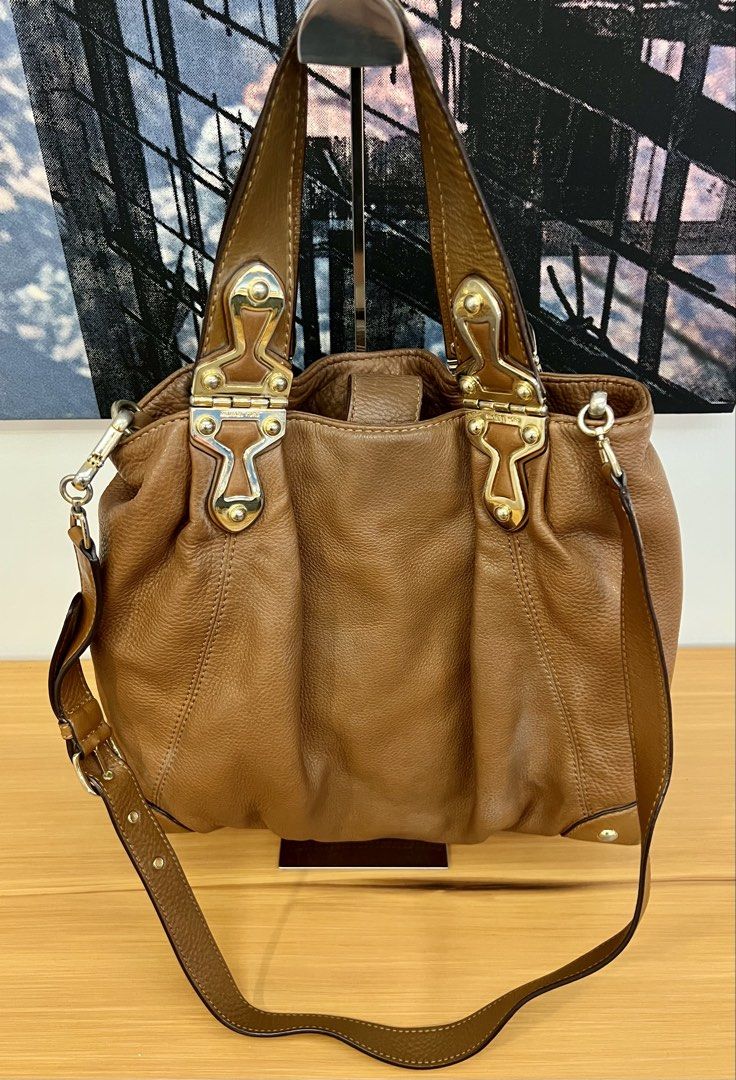 Michael Kors Brown Leather Shoulder Hobo Bag (Category: Luxury Bags & Wallets) located in Manila. Submitted by pearlt455 (Listing ID 1464241859, Image 3). Description: - Authentic Michael Kors brown cow leather shoulder hobo bag - Pre-loved, well used - Elegant gold-tone hardware - Roomy interior with multiple pockets for organization - Detachable shoulder strap for versatile styling - Beautiful leather texture, perfect for everyday wear.