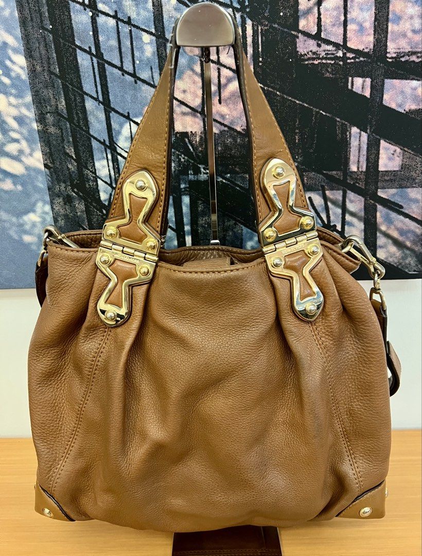 Michael Kors Brown Leather Shoulder Hobo Bag (Category: Luxury Bags & Wallets) located in Manila. Submitted by pearlt455 (Listing ID 1464241859, Image 2). Description: - Authentic Michael Kors brown cow leather shoulder hobo bag - Pre-loved, well used - Elegant gold-tone hardware - Roomy interior with multiple pockets for organization - Detachable shoulder strap for versatile styling - Beautiful leather texture, perfect for everyday wear.