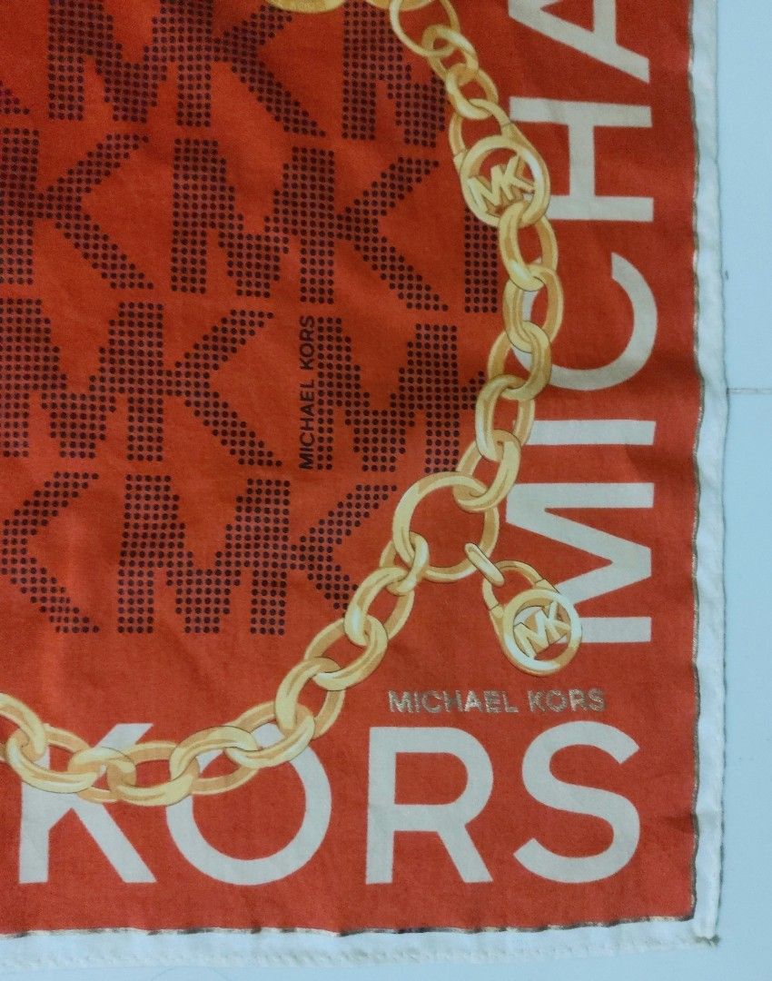 Michael Kors MK Monogram Chain Print handkerchief (Category: Handkerchief & Pocket Squares) located in Lapu Lapu. Submitted by agnesapm_29813 (Listing ID 1464253942, Image 3). Description: - Authentic Michael Kors handkerchief - Vibrant orange color - Signature MK monogram pattern - Elegant gold chain print overlay - Michael Kors logo repeated along the edges - Dimensions: 19.5 x 19.5 inches - Washed and ironed already .