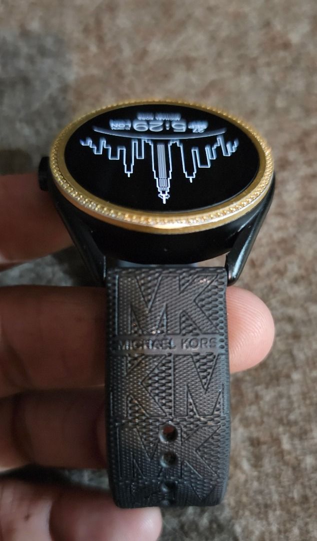 MICHAEL KORS MKGO 5e Smartwatch (Category: Wearables & Smart Watches) located in Caloocan City. Submitted by yatsbatoyskie (Listing ID 1464345069, Image 3). Description: MICHAEL KORS MKGO 5e Smartwatch Google Assistant- Black & Gold, Silicone Strap 43mm aluminum case calls weather heart rate play music and make contactless payments (google pay) google fit download songs to the 4 GB of internal memory, and track your location using the untethered 