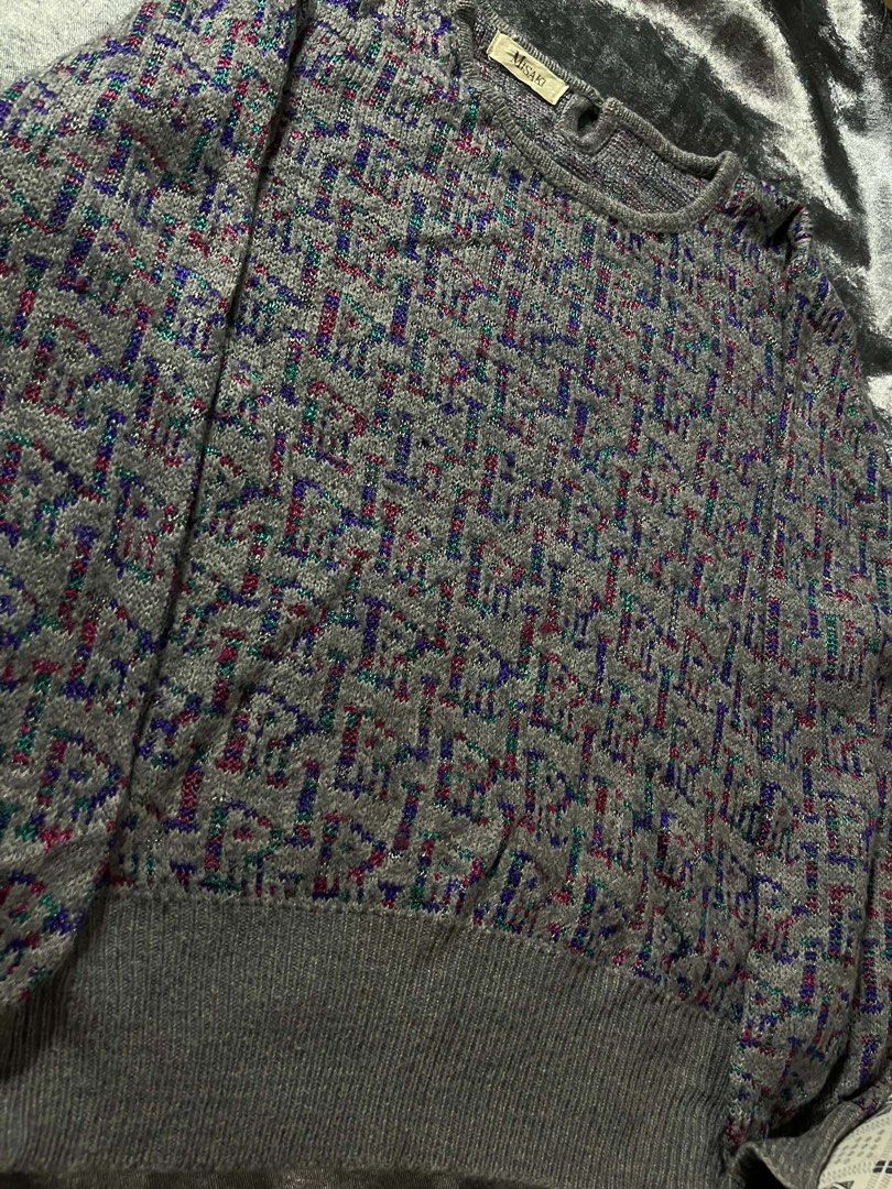 Misaki Grey Knit Sweater with Colorful Pattern (Category: Coats, Jackets and Outerwear) located in General Trias. Submitted by kevinthriftshop (Listing ID 1464289350, Image 3). Description: - Grey knit sweater from Misaki - Features a repeating pattern with hints of red, blue, and green - Crew neck, long sleeves - Ribbed cuffs and hem - Cozy and perfect for cooler weather - Great for layering or wearing on its own.