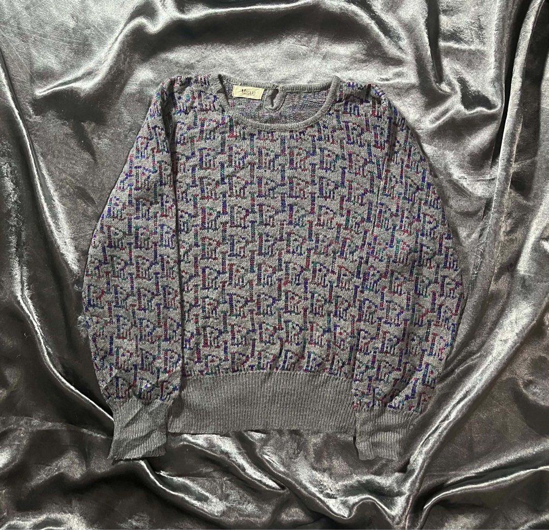 Misaki Grey Knit Sweater with Colorful Pattern (Category: Coats, Jackets and Outerwear) located in General Trias. Submitted by kevinthriftshop (Listing ID 1464289350, Image 1). Description: - Grey knit sweater from Misaki - Features a repeating pattern with hints of red, blue, and green - Crew neck, long sleeves - Ribbed cuffs and hem - Cozy and perfect for cooler weather - Great for layering or wearing on its own.