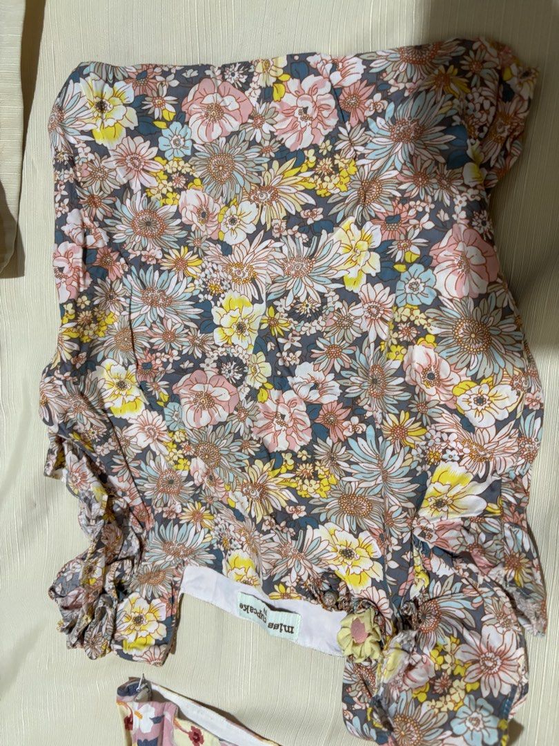 Miss Cupcake Floral Tops (Size 14) (Category: Babies & Kids Fashion) located in Makati City. Submitted by issa124 (Listing ID 1464311273, Image 3). Description: - Two adorable floral tops from Miss Cupcake - Size 14 - Pink top: V-neck with red flower detail - Grey top: Square neckline - Both tops feature charming ruffled sleeves - Versatile for everyday wear or special occasions - Your little one will surely love these! - chest :13 inches when la