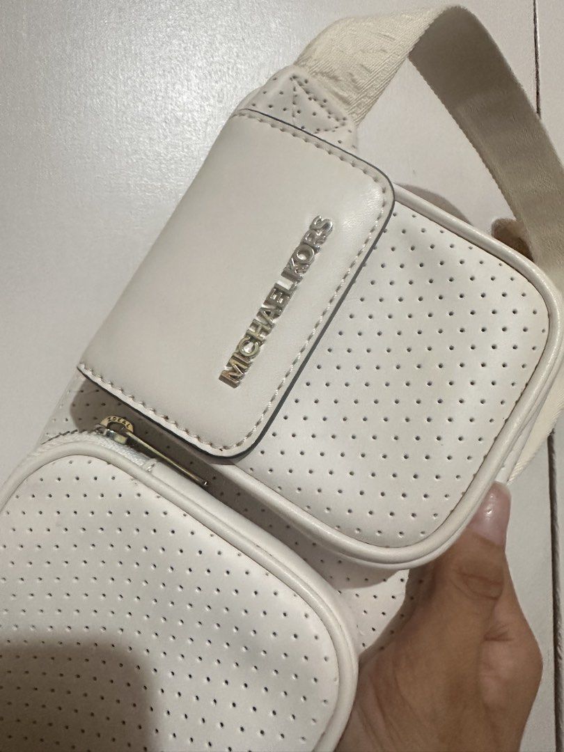 Mk belt bag (Category: Cross-body Bags) located in Tandag. Submitted by kawaiispreloved (Listing ID 1464212778, Image 2). Description: Original Michael Kors beltbag With signs of usage ( actually nakatambak lang) .