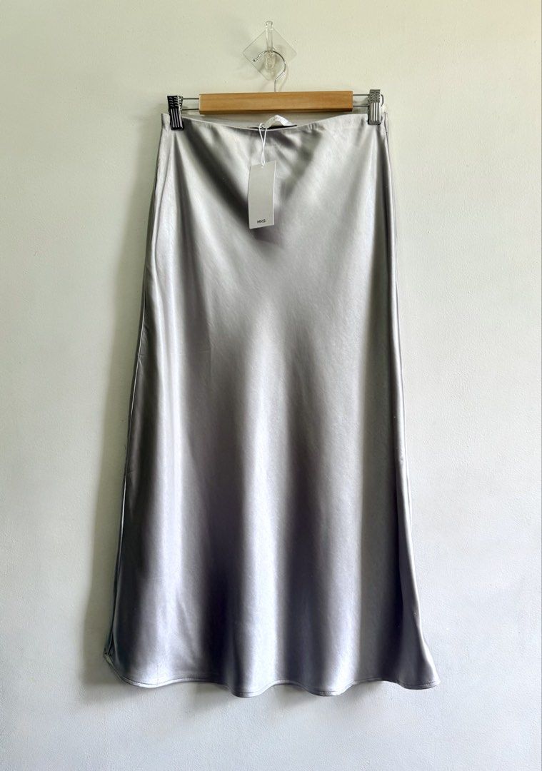 MNG satin skirt (Category: Skirts) located in Tarlac. Submitted by giannisdeclutters4106 (Listing ID 1464206072, Image 3). Description: Brand new with tag Small on tag. Fits 26-29” With tiny unnoticeable runs Visible only when you look closely..