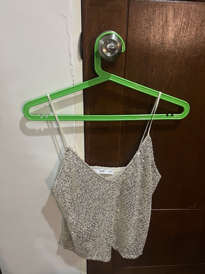 MNG Sequin Spaghetti Strap Crop Top (Category: Sleeveless) located in Pasig City. Submitted by kakerts (Listing ID 1464290122, Image 1). Description: - MNG crop top - Covered in shimmering silver sequins - Features delicate spaghetti straps - Ideal for parties, clubbing, or a night out - In great pre-loved condition - Ready for its next fabulous owner!.