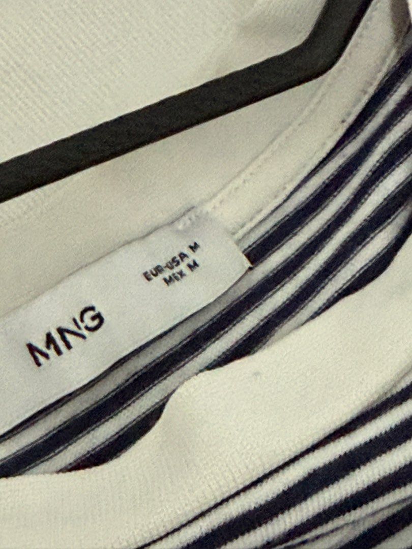 MNG Striped T-shirt Size M (Category: Shirts) located in Mandaluyong City. Submitted by trovebya (Listing ID 1464239906, Image 3). Description: - Classic navy and white stripes - Brand: MNG - Short sleeves - Crew neck - Versatile for casual wear - Easy to pair with jeans or shorts.