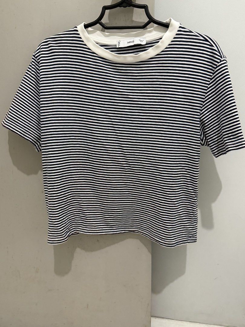 MNG Striped T-shirt Size M (Category: Shirts) located in Mandaluyong City. Submitted by trovebya (Listing ID 1464239906, Image 1). Description: - Classic navy and white stripes - Brand: MNG - Short sleeves - Crew neck - Versatile for casual wear - Easy to pair with jeans or shorts.