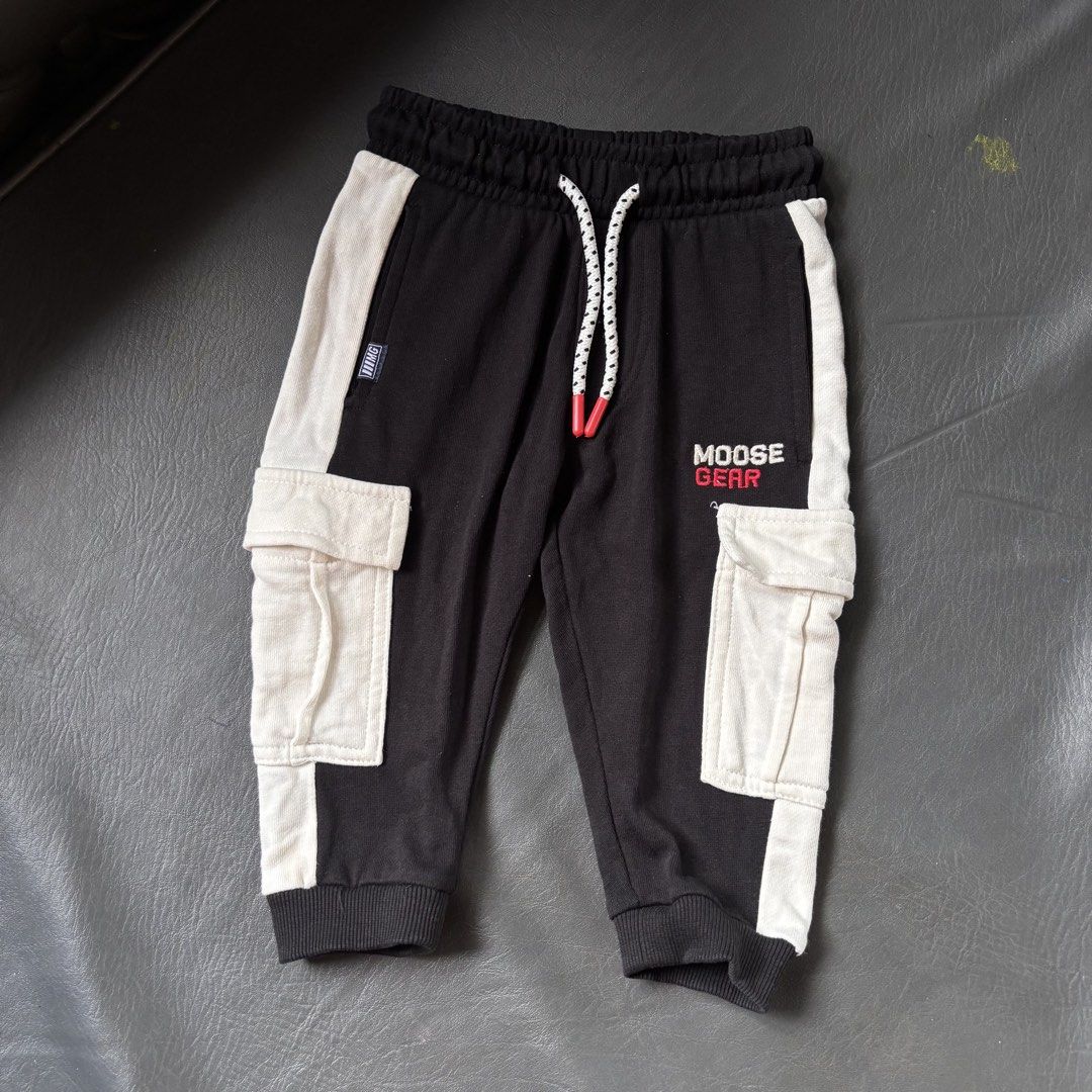 Moose Gear Kids Cargo Jogger Pants (Category: Babies & Kids Fashion) located in Mati. Submitted by sharieeng (Listing ID 1464147480, Image 1). Description: - Black jogger pants for kids - White accents and cargo pockets - Drawstring waist and elastic cuffs - Moose Gear logo on the leg - Comfortable and stylish for everyday wear.