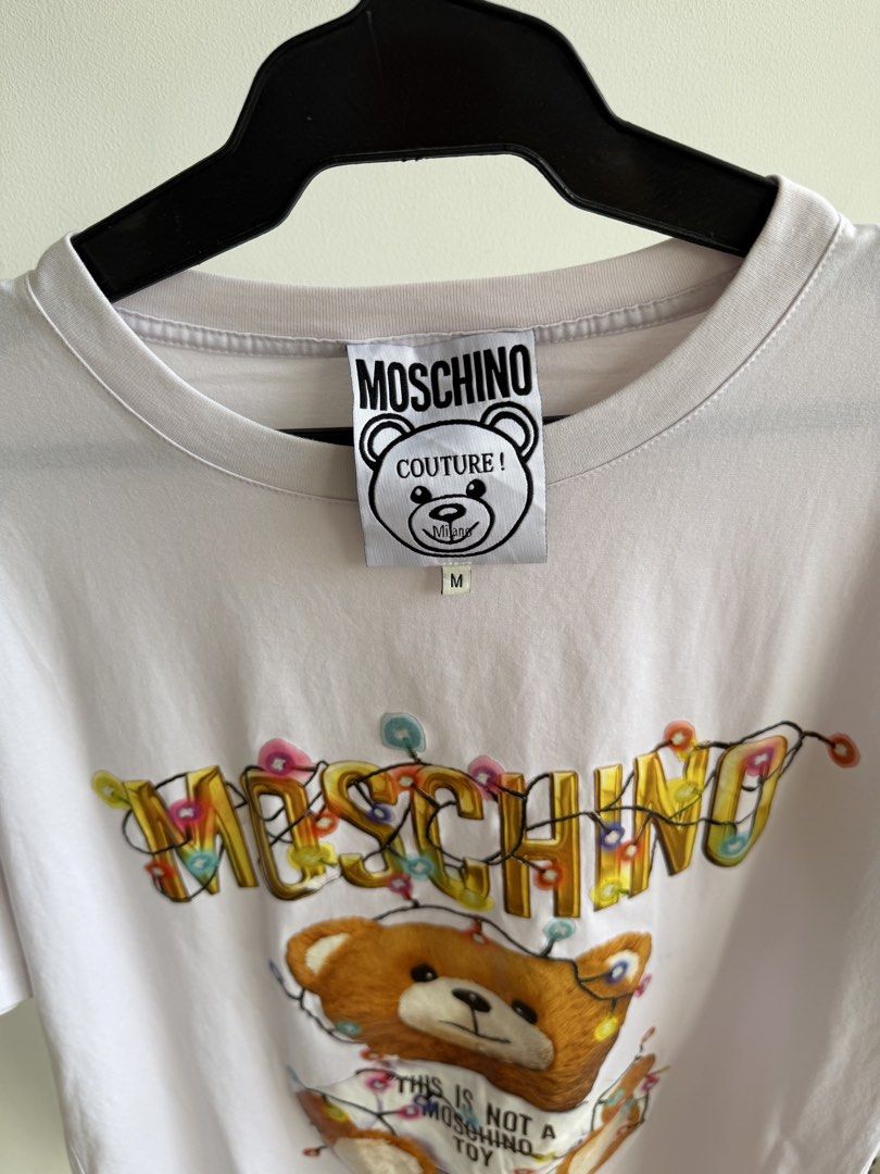 Moschino (Category: Tshirts & Polo Shirts ) located in Angeles City. Submitted by afterwear.thrift (Listing ID 1464292488, Image 3). Description: Moschino W20” xL27” Branded. Curated item that is good as new..
