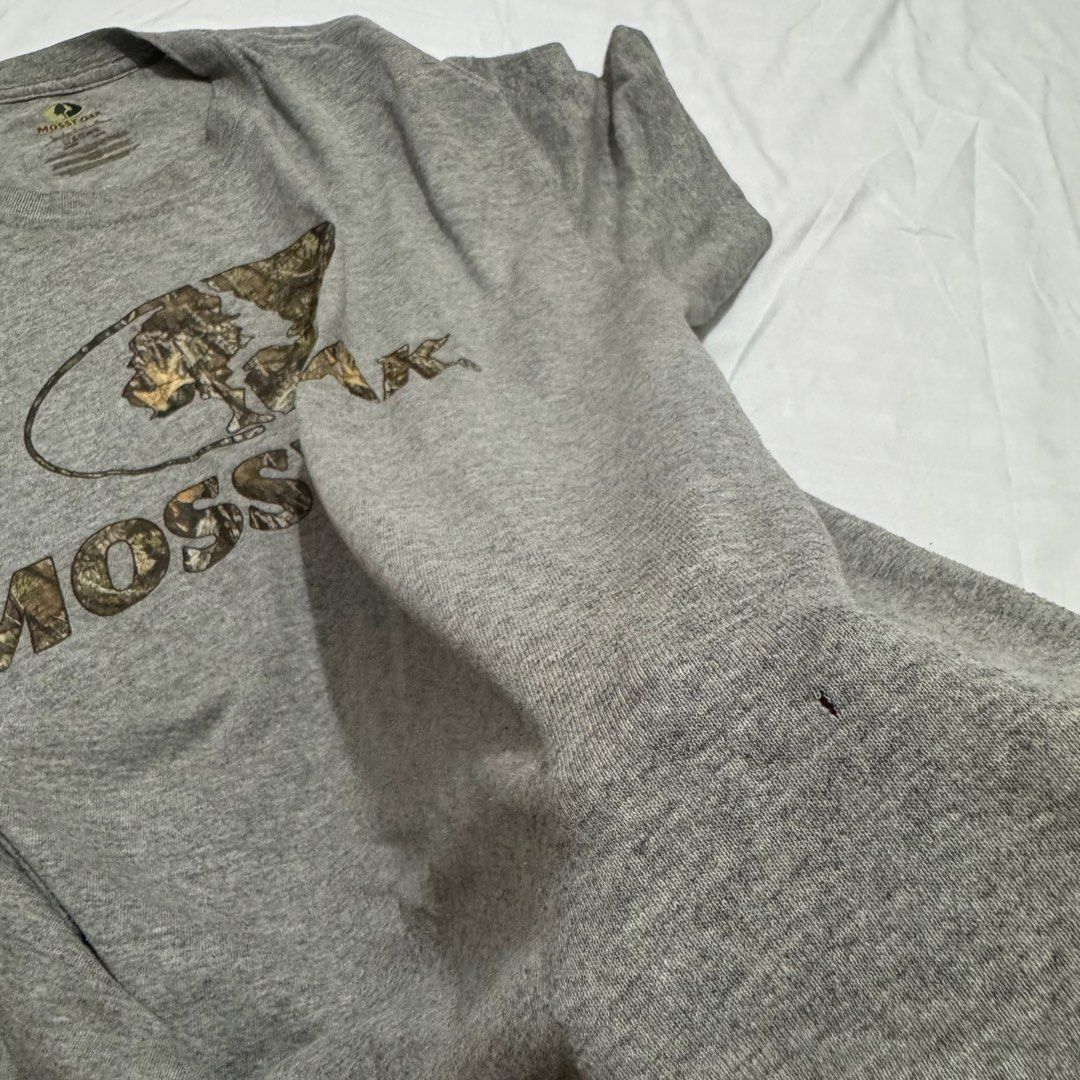 MOSSY OAK (Category: Tshirts & Polo Shirts ) located in Pasig City. Submitted by jaaard (Listing ID 1464247465, Image 3). Description: Mossy oak Size L 23x29.5 Good condition need wash 1 repaired pinhole issue rightside front part pm me for more details.