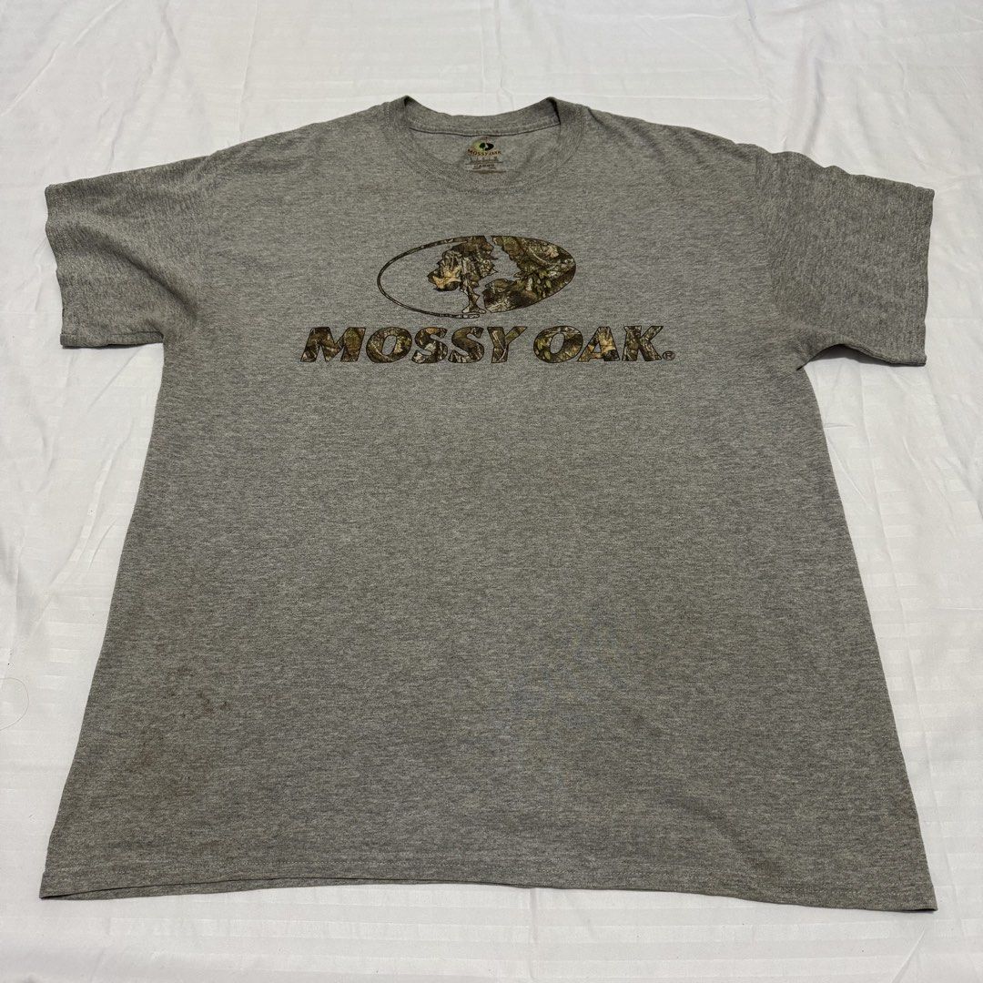 MOSSY OAK (Category: Tshirts & Polo Shirts ) located in Pasig City. Submitted by jaaard (Listing ID 1464247465, Image 1). Description: Mossy oak Size L 23x29.5 Good condition need wash 1 repaired pinhole issue rightside front part pm me for more details.