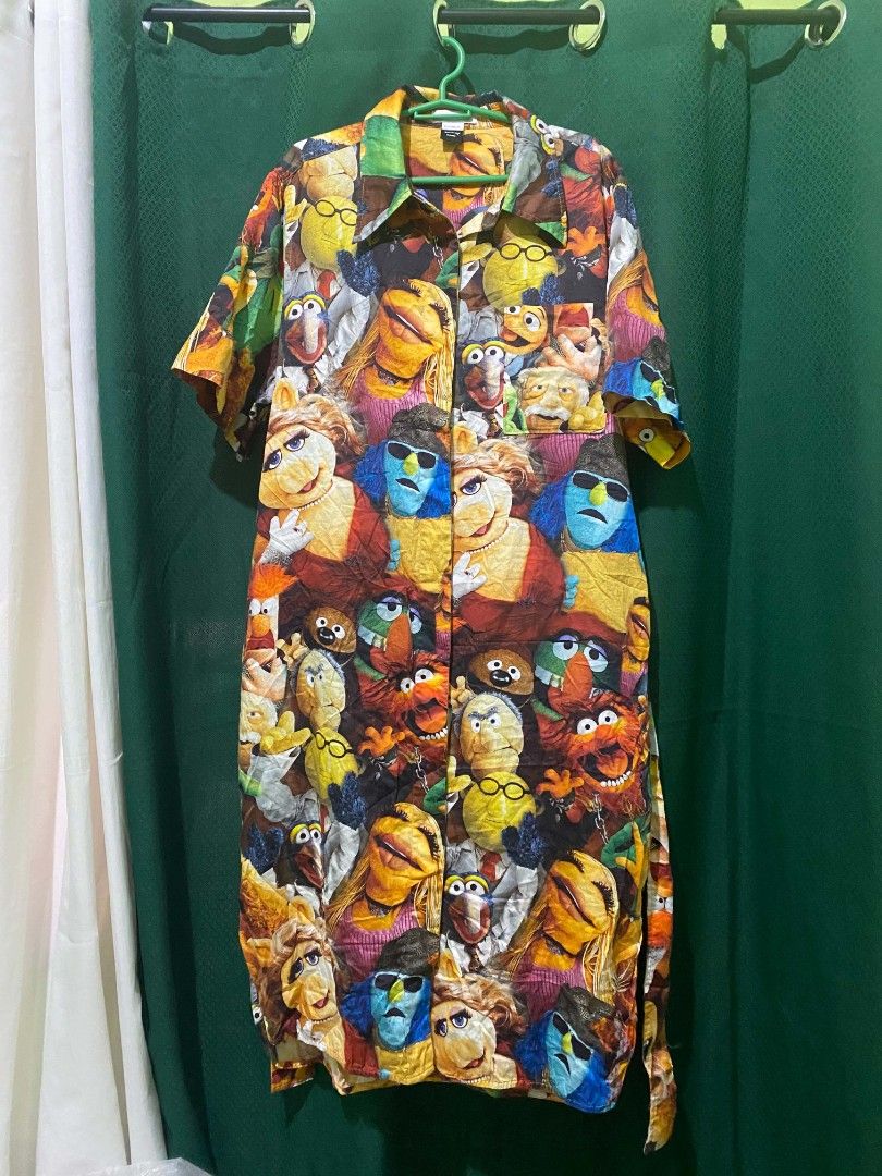 Muppet Characters Print Button-Up Shirt Dress with Belt (Category: Dresses) located in Quezon City. Submitted by elihur.tuazon (Listing ID 1464299727, Image 1). Description: - Vibrant dress featuring a fun Muppet character print. - Short sleeves and a classic collared neckline. - Includes a matching fabric belt to define your waist. - Ideal for everyday casual wear or a unique themed party outfit. - Stand out with this one-of-a-kind print!.