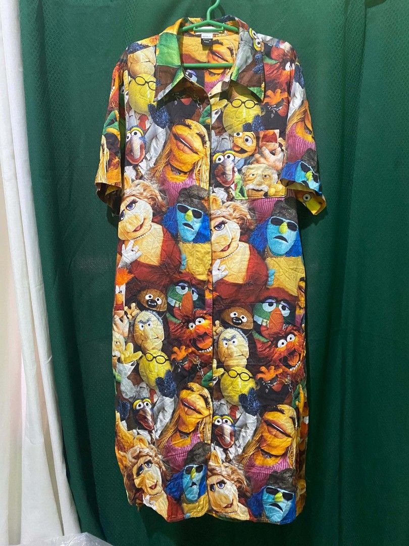 Muppet Characters Print Button-Up Shirt Dress with Belt (Category: Dresses) located in Quezon City. Submitted by elihur.tuazon (Listing ID 1464299727, Image 3). Description: - Vibrant dress featuring a fun Muppet character print. - Short sleeves and a classic collared neckline. - Includes a matching fabric belt to define your waist. - Ideal for everyday casual wear or a unique themed party outfit. - Stand out with this one-of-a-kind print!.