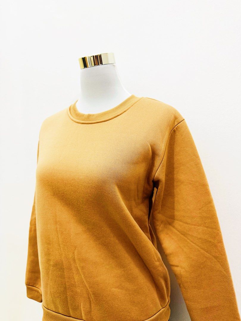 Mustard Yellow Crewneck Sweatshirt (Category: Coats, Jackets and Outerwear) located in Manila. Submitted by e.louise (Listing ID 1464333178, Image 1). Description: - Comfy mustard yellow sweatshirt - Classic crewneck style - Long sleeves with ribbed cuffs - Ribbed hem for a snug fit - Versatile for layering or standalone wear - Easily pairs with jeans, skirts, and more.