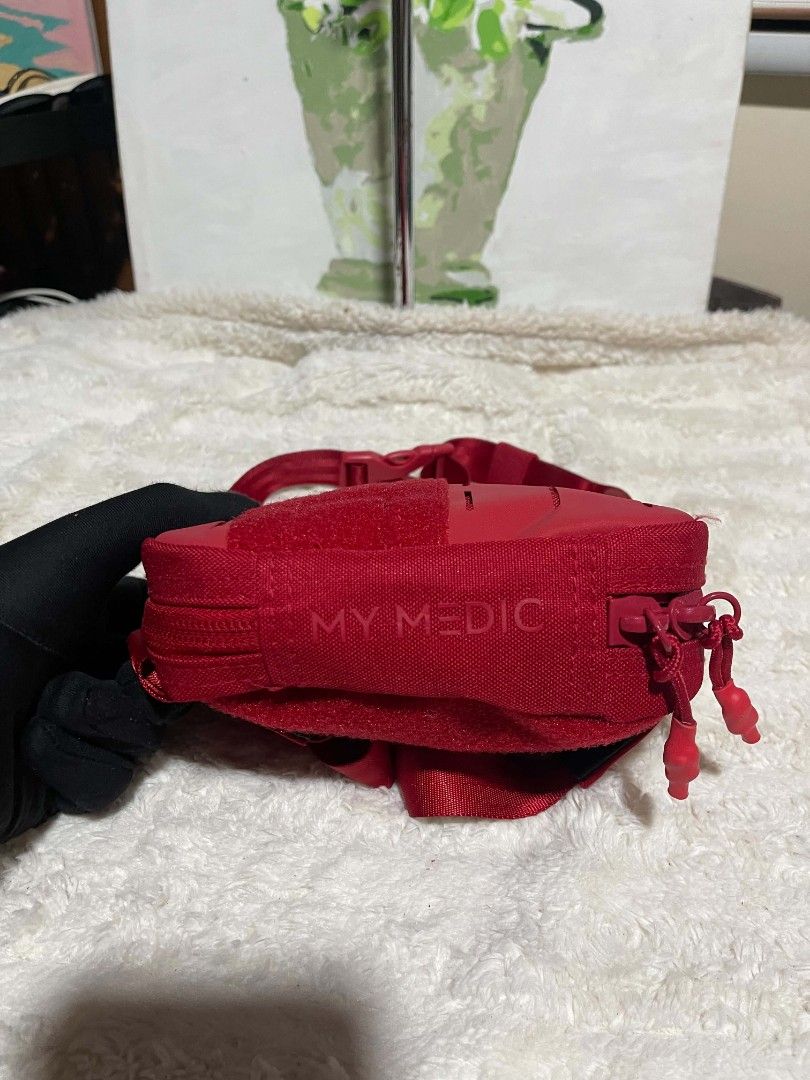 MY MEDIC Red belt Bag (Category: Cross-body Bags) located in Naawan. Submitted by twilly.apparel2 (Listing ID 1464241185, Image 3). Description: - Red pouch bag from MY MEDIC - MOLLE compatible webbing on front - Zipper closure - Adjustable strap included - Small and compact size - Ideal for organizing small essentials.