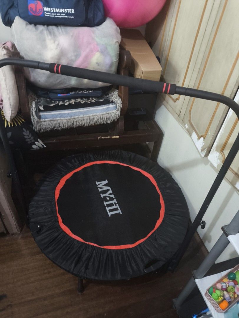 MY-FIT Trampoline with Handle (Category: Infant Playtime) located in Makati City. Submitted by clevercrystal_8f51f3 (Listing ID 1464276572, Image 1). Description: - Mini trampoline perfect for home workouts - Features a stability handle for support - Stylish black mat with red trim - Ideal for cardio and fitness routines - Folds easily for convenient storage.