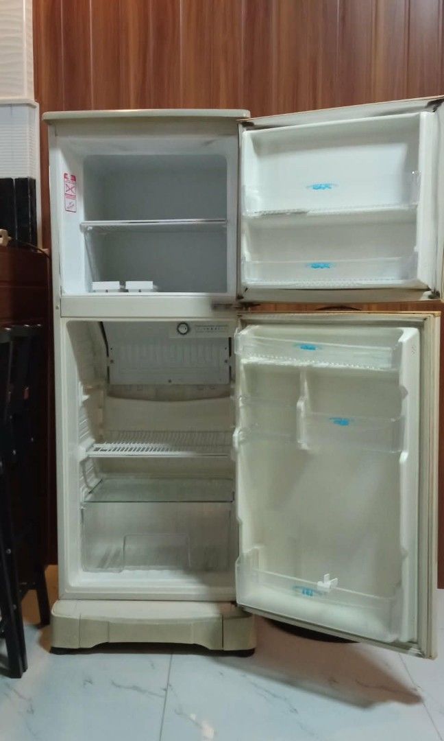 National Refrigerator Cream Color (Category: Refrigerators and Freezers) located in Caloocan City. Submitted by gold_m (Listing ID 1464171453, Image 2). Description: - Cream colored National refrigerator - Two doors with top freezer compartment - Ideal for small spaces - Fully functional and working - Minor exterior scuffs and discoloration (age-appropriate) - Clean interior - Ready for a new home.