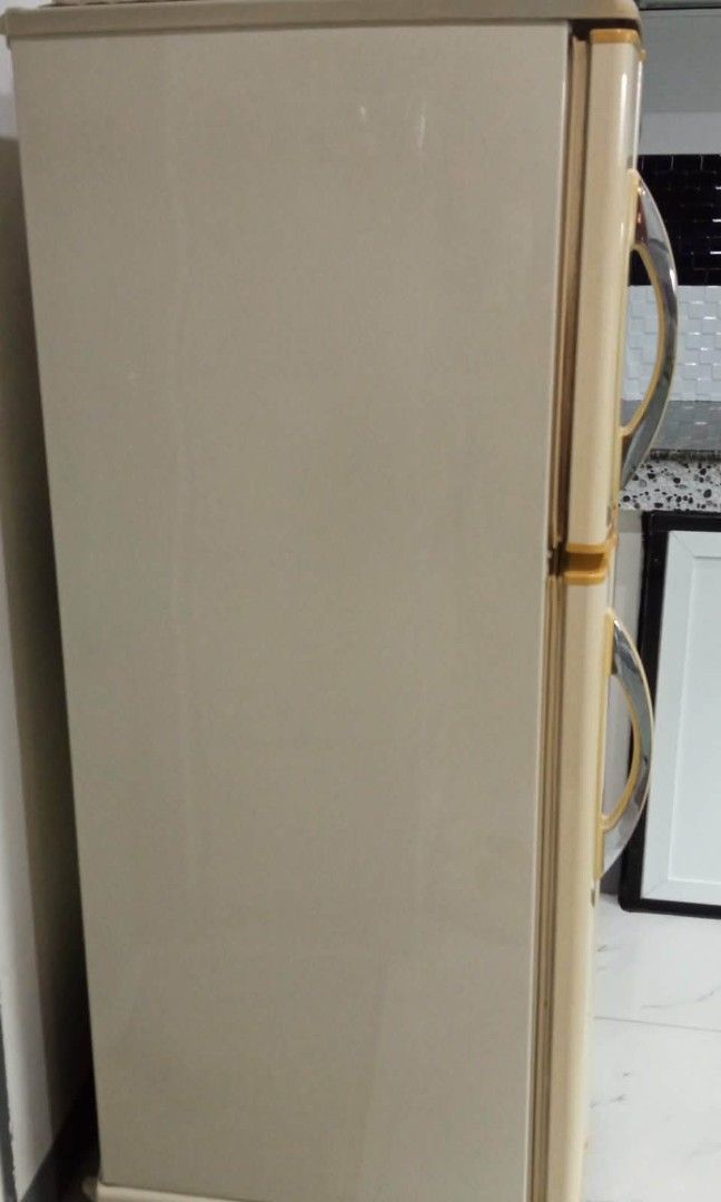 National Refrigerator Cream Color (Category: Refrigerators and Freezers) located in Caloocan City. Submitted by gold_m (Listing ID 1464171453, Image 3). Description: - Cream colored National refrigerator - Two doors with top freezer compartment - Ideal for small spaces - Fully functional and working - Minor exterior scuffs and discoloration (age-appropriate) - Clean interior - Ready for a new home.