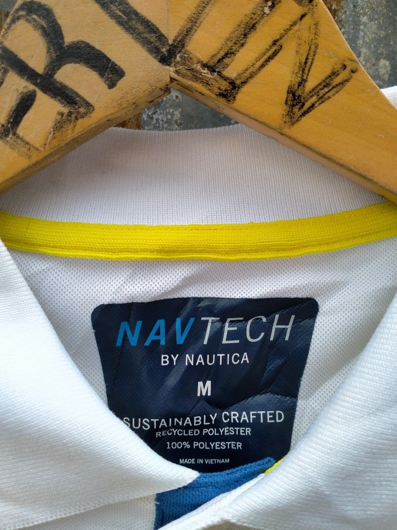 Nautica Navtech Polo Shirt Size M (Category: Tshirts & Polo Shirts ) located in Davao. Submitted by ervinpolino09 (Listing ID 1464180194, Image 3). Description: - Nautica Navtech Polo Shirt - Color: White with blue and yellow chest stripes - Material: 100% Recycled Polyester - Feature: Sustainably crafted - Size: Medium (M)-Large Dimension width 22 length 27.5 As new condition - Perfect for: Casual outings or sports activities.