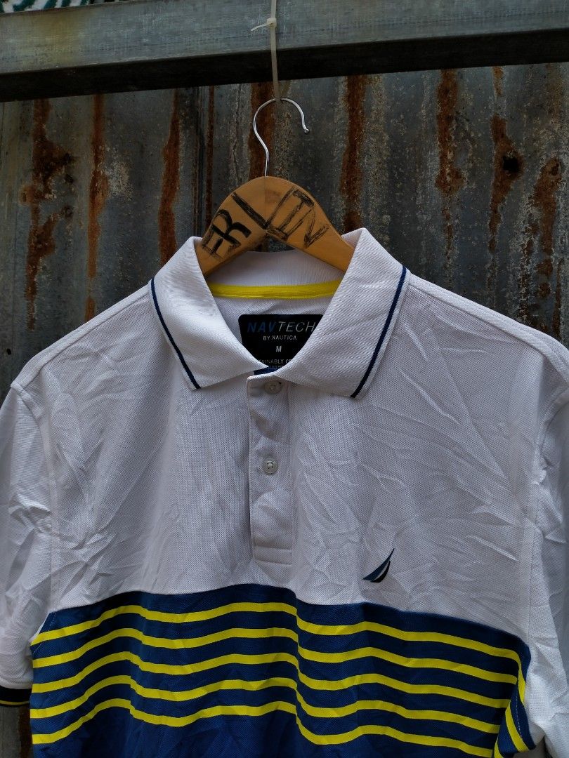 Nautica Navtech Polo Shirt Size M (Category: Tshirts & Polo Shirts ) located in Davao. Submitted by ervinpolino09 (Listing ID 1464180194, Image 2). Description: - Nautica Navtech Polo Shirt - Color: White with blue and yellow chest stripes - Material: 100% Recycled Polyester - Feature: Sustainably crafted - Size: Medium (M)-Large Dimension width 22 length 27.5 As new condition - Perfect for: Casual outings or sports activities.