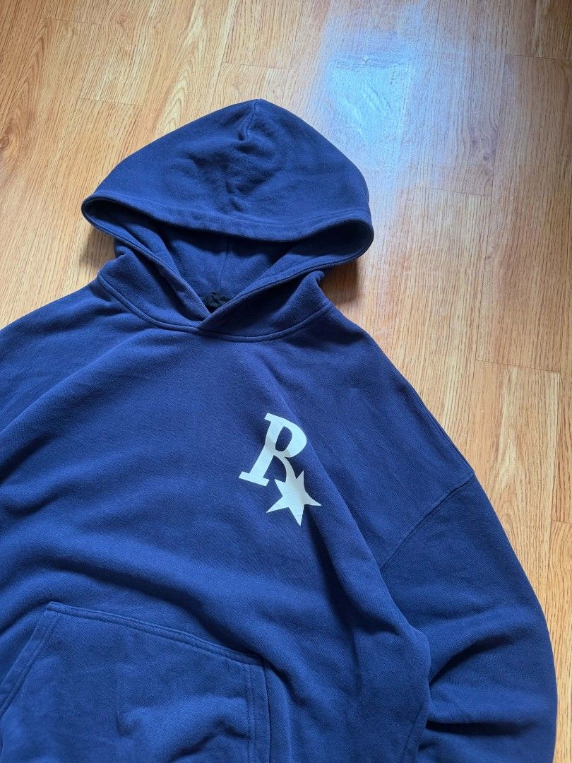 Navy Blue Boxy Hoodie (Category: Coats, Jackets and Outerwear) located in Angeles City. Submitted by repurposedwear (Listing ID 1464170631, Image 2). Description: Navy blue hoodie with white 'R*' logo on front and back. Features a front pocket and hood. Perfect for casual, everyday wear. Must have, heavy fabric🫵 Design and fitting goes hardd🔥 No issues/Ready to wear Dimes : W : 26 L : 28.5.