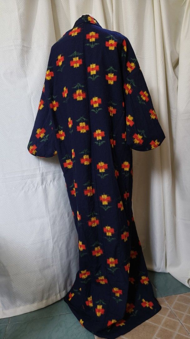 Navy Blue Floral Kimono Robe (Category: Dresses) located in Taguig. Submitted by ymicloset (Listing ID 1464217608, Image 2). Description: - Beautiful navy blue kimono robe - Features a repeating pattern of red and yellow flowers with green stems - Fabric has a nice drape - Great for lounging or as a stylish cover-up - Open front design - Wide and flowy sleeves -Shoulder 26 in -Waist 48 in -Sleeve 17 in -Length 60 in.