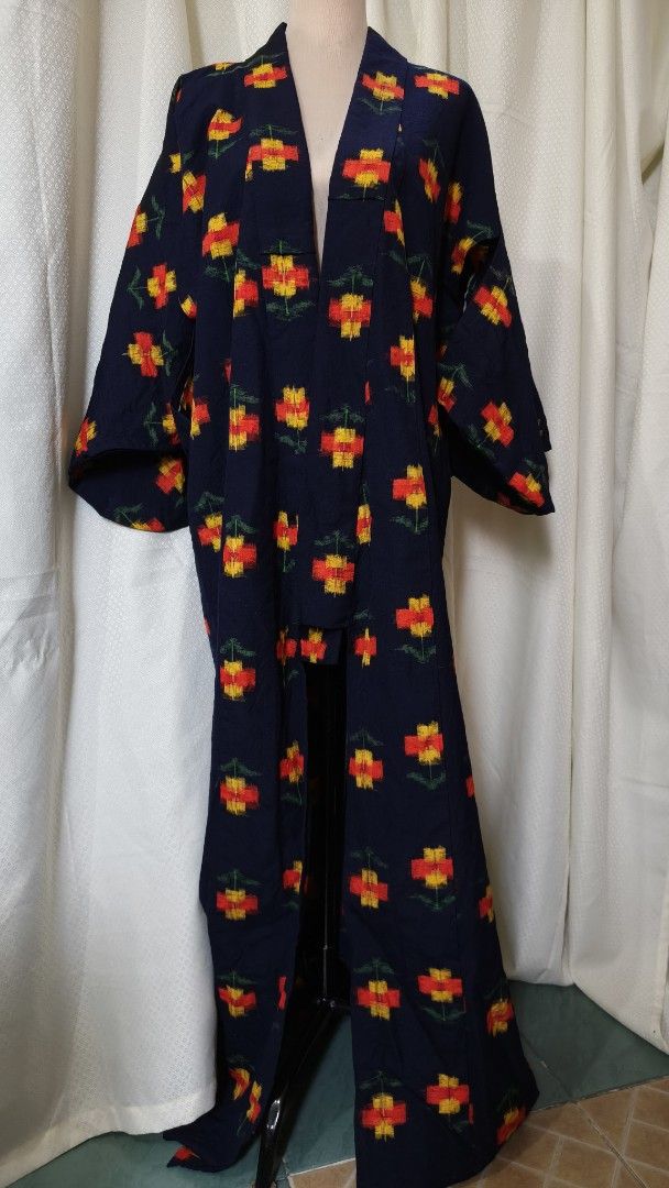 Navy Blue Floral Kimono Robe (Category: Dresses) located in Taguig. Submitted by ymicloset (Listing ID 1464217608, Image 1). Description: - Beautiful navy blue kimono robe - Features a repeating pattern of red and yellow flowers with green stems - Fabric has a nice drape - Great for lounging or as a stylish cover-up - Open front design - Wide and flowy sleeves -Shoulder 26 in -Waist 48 in -Sleeve 17 in -Length 60 in.