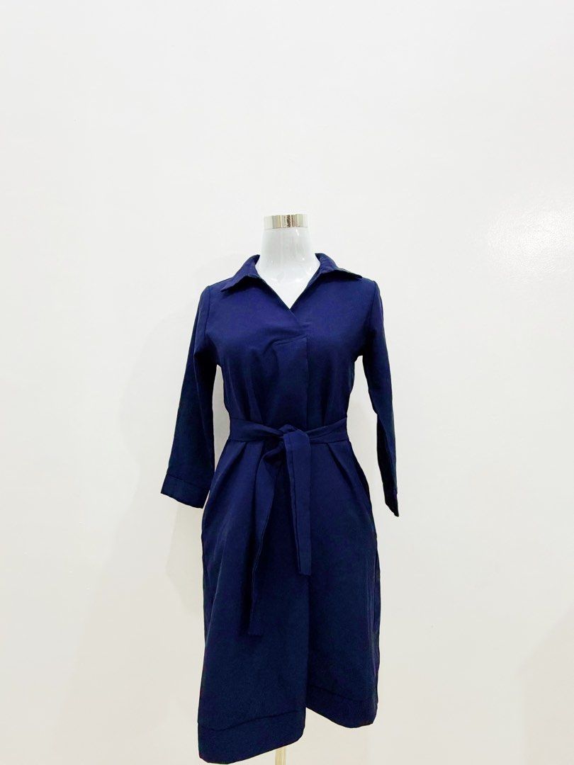 Navy Blue Wrap Dress with Belt (Category: Dresses) located in Manila. Submitted by e.louise (Listing ID 1464333053, Image 3). Description: - Chic navy blue wrap dress - Features a tie belt to cinch the waist - Elegant collar neckline - Long sleeves for added coverage - Convenient pockets included - Versatile for work or casual wear - Effortless to style for any occasion.
