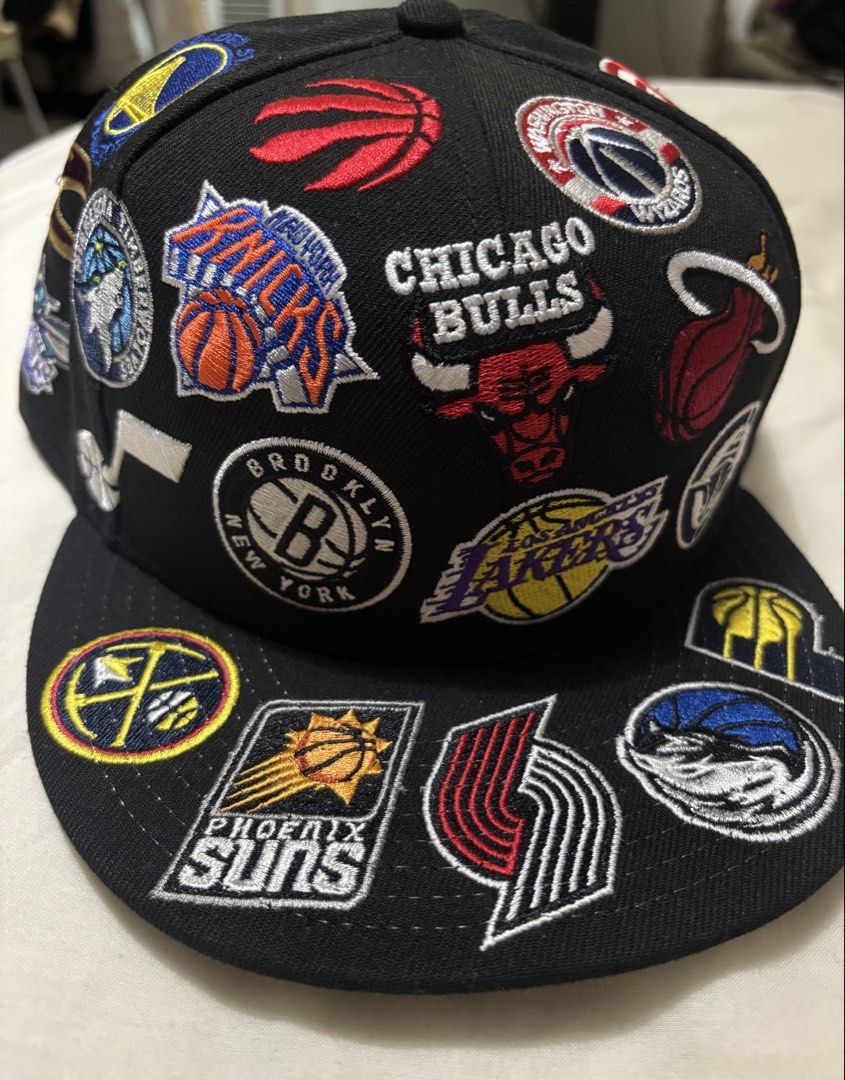 New Era Cap 950 NBA League Allover Snapback Hat (Medium/Large) (Category: Caps & Hats) located in Taguig. Submitted by dekatrio (Listing ID 1464164830, Image 2). Description: - Original Price: Pho 4,595 - Brand New Black New Era 9FIFTY Snapback Hat - Features multiple NBA team logos all over - Size: Medium/Large - Comes with original tags - Ideal for any basketball fan.