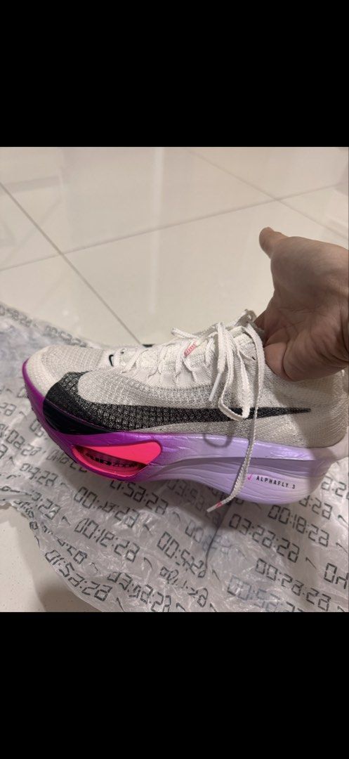 Nike Alphafly 3 running shoes (Category: Sneakers) located in Quezon City. Submitted by mtag3 (Listing ID 1464143619, Image 1). Description: - Nike Alphafly 3 - Color: White with vivid purple accent - US 7.5/ 25.5cm - used for 2 races only - RFS not running anymore .