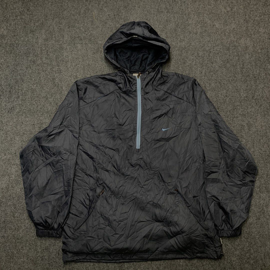 Nike Anorak Hooded Windbreaker Jacket (Category: Coats, Jackets and Outerwear) located in Imus. Submitted by la.wigginss0 (Listing ID 1464141015, Image 3). Description: - Dark grey Nike anorak jacket - Size XXL - Lightweight material, ideal for windy conditions - Features a half-zip closure - Includes a hood - Mesh lining for comfort - Made in Indonesia.