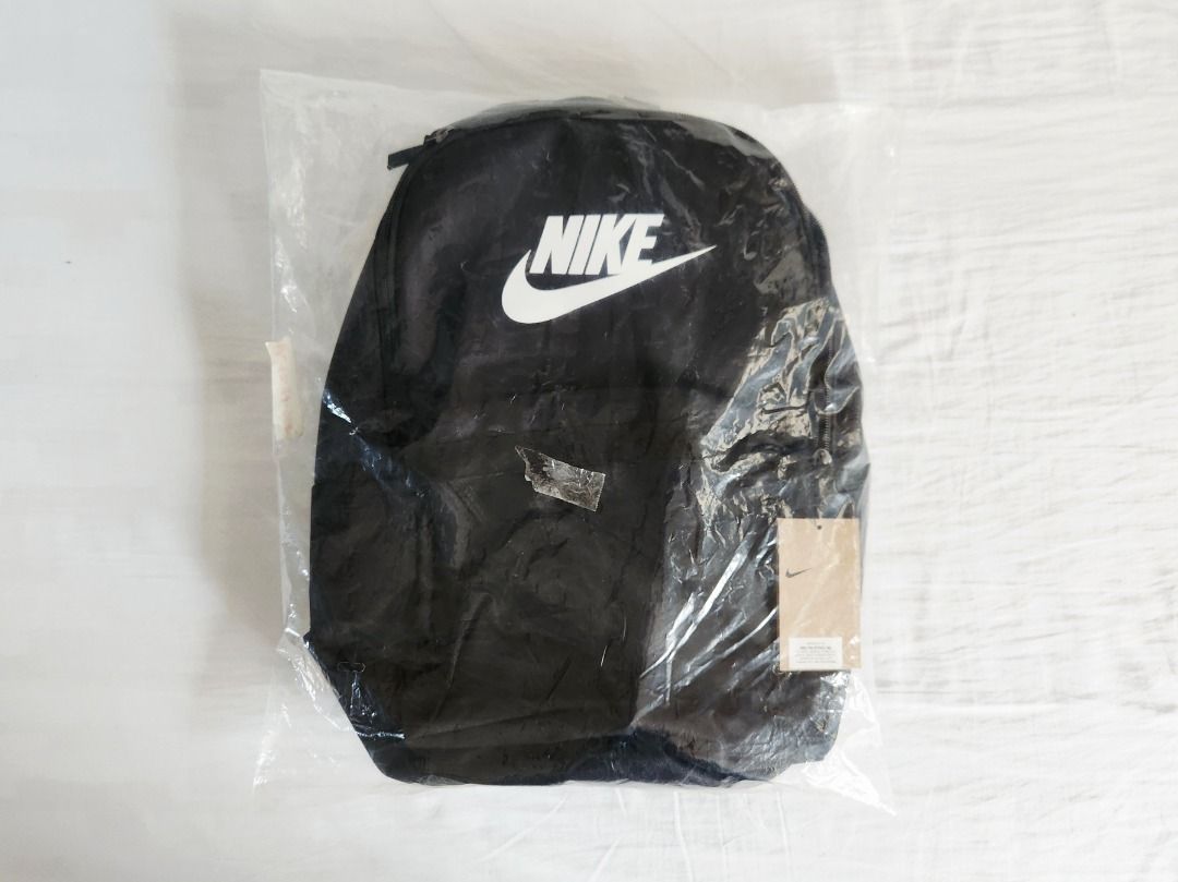 NIKE Black Backpack (Category: Backpacks) located in Taguig. Submitted by aip12 (Listing ID 1464208205, Image 2). Description: - Height: 16.5", Width: 11.5" - Classic black Nike backpack - Iconic Nike swoosh logo - Main compartment and front pocket - Padded straps for comfort - Ideal for school, gym, or everyday use - Brand new with tags attached Please notify one day before the meet-up day. MEET UP AREAS: Glorietta/Greenbelt/Landmark/SM Makati/V