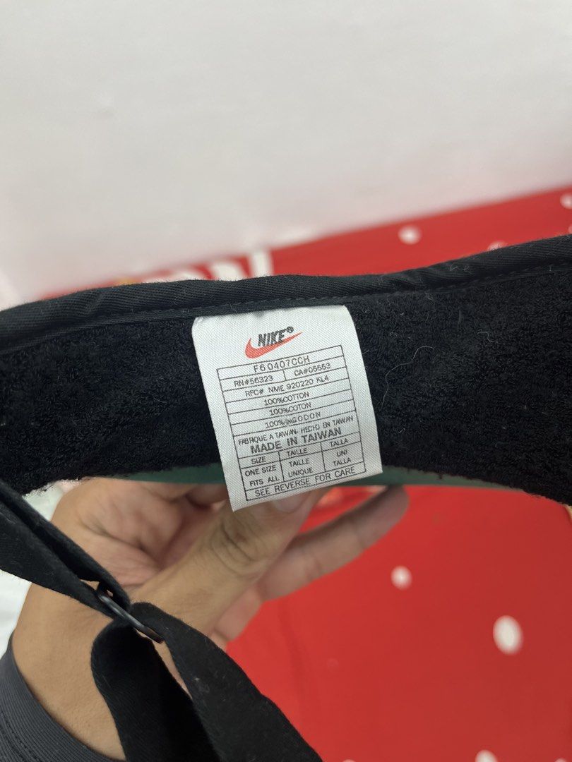 Nike Black Visor Cap Hat (Category: Caps & Hats) located in Balamban. Submitted by gogochrist09668 (Listing ID 1464165244, Image 3). Description: - Classic Nike visor - Features iconic Nike swoosh logo - Circular logo on the front - Adjustable strap at the back for a custom fit - Made in Taiwan - Ideal for sports activities or everyday casual wear.