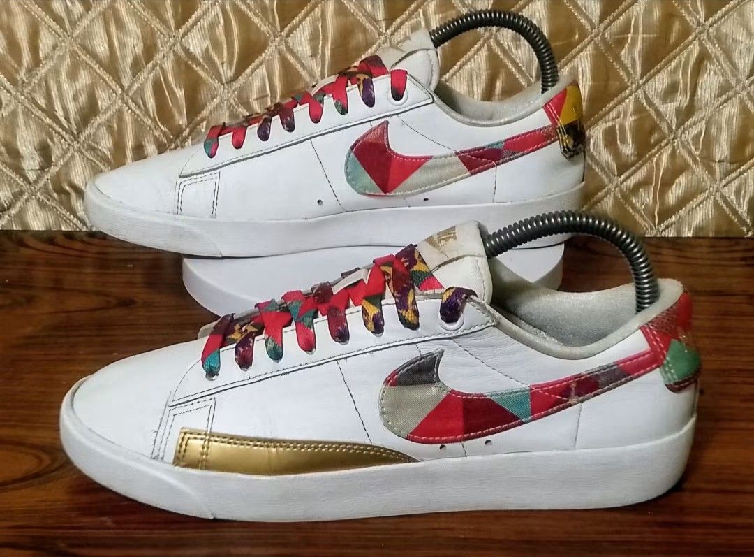 Nike Blazer Low White Geometric Patch Gold Accent (Category: Sneakers) located in Lupao. Submitted by selahthriftedclothing (Listing ID 1464271651, Image 1). Description: - White Nike Blazer Lows - Unique geometric patch design on swoosh and heel - Colorful patterned laces for a pop of color - Gold accent on the toe cap - Ideal for casual everyday wear.